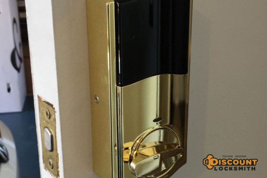 Smart lock installation on residential front door by locksmith in Tucson Arizona
